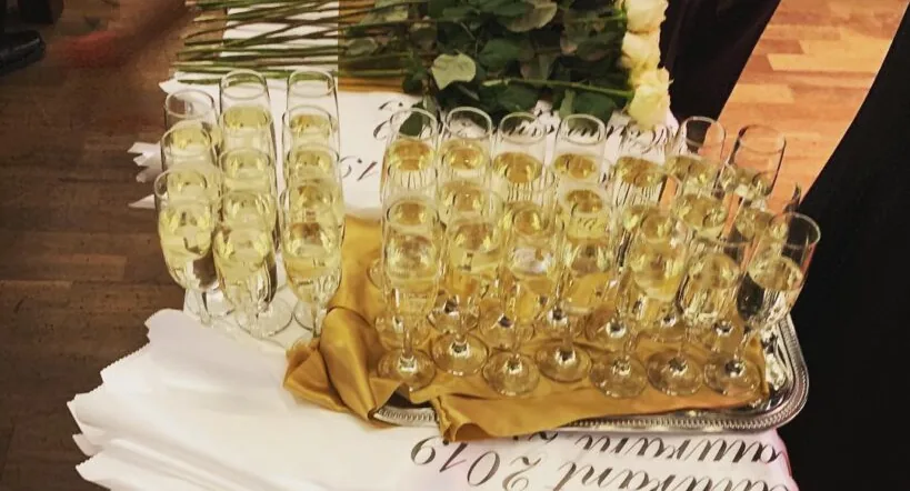 A tray of sparkling wine glasses